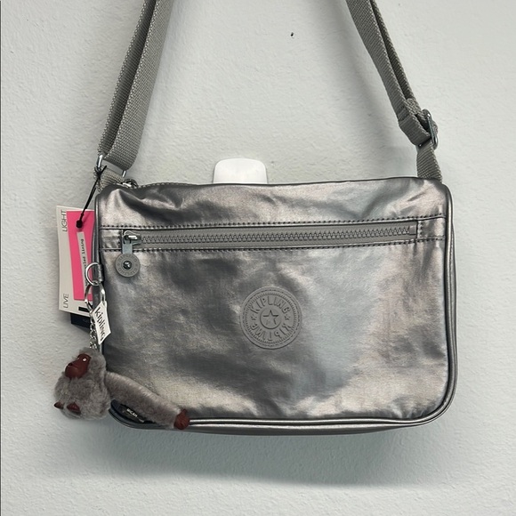 Kipling Handbags - Kipling Silver Crossbody Bag with Iconic Charm “Micah” 🦍